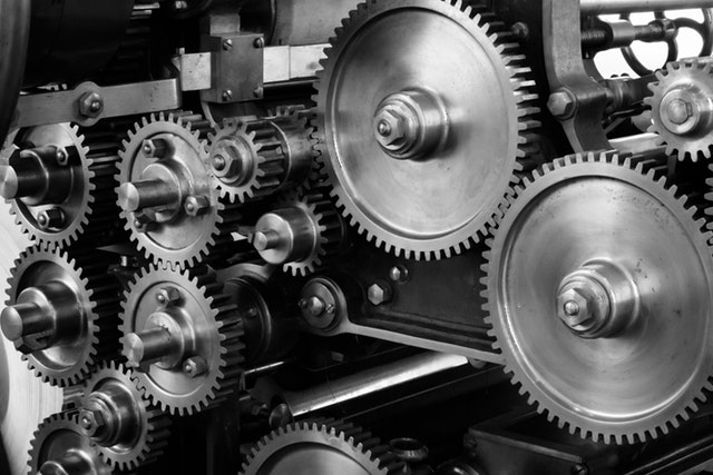 Shiny metal cogs of a complex machine